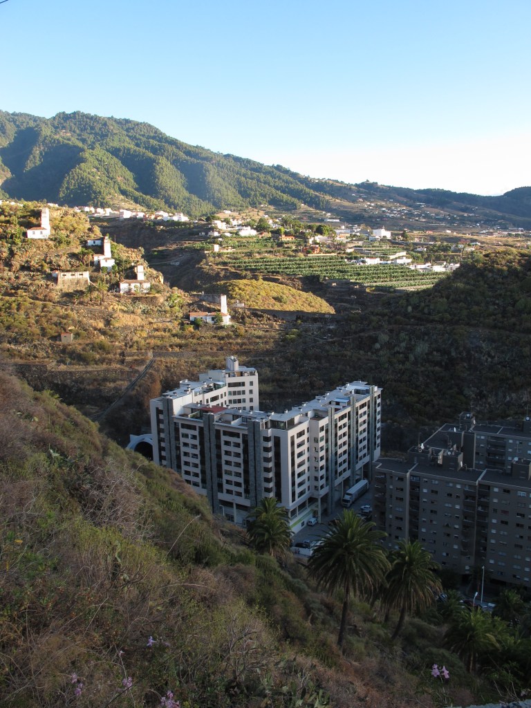 Looking down on 10 story buildings of Santa Cruz de La Palma, Spain at sunrise. By Ronny Errmann