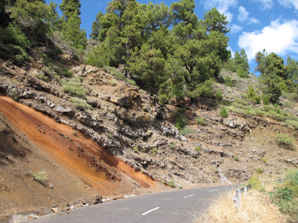 Different layers of volcanic eruptions. Colored ash and layers of lava flows.