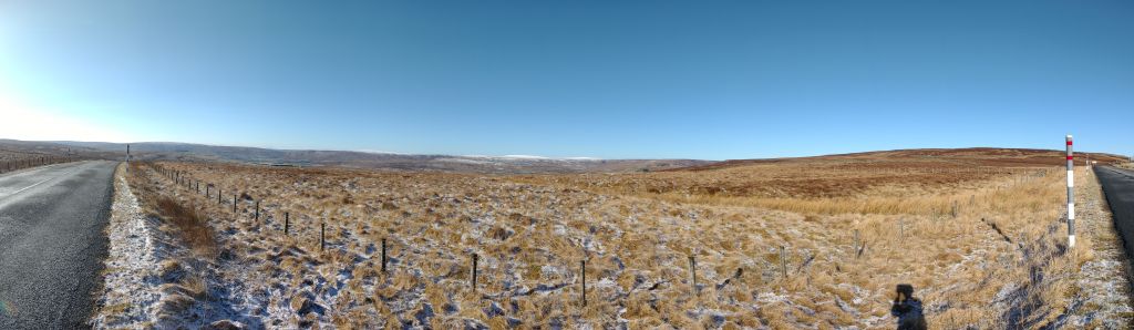 The view all around was great (180° panorama), very alpine, although I was still just at under 600 m altitude. According to the definition from friends, that was also the first mountain: There are no more trees growing on the summit. The highest saddles of the North Pennines were all white. I came from the right and soon will go down to the left.